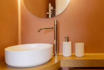 a bathroom with a sink and a mirror at Valenza Exclusive Suites & Rooms in Palermo