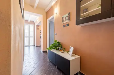 a hallway of a room with a counter with a plant at nonMama - Comfort & charm in Partanna Mondello in Palermo