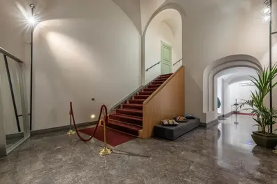 a hallway with a staircase in a building at Bellini Apartment by Wonderful Italy in Palermo
