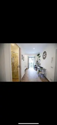 a living room with a table and a dining room at Duomo View Apartment in Monreale