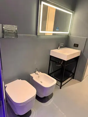 a bathroom with a toilet and a sink at Abracadabra Hidden Garden in Palermo
