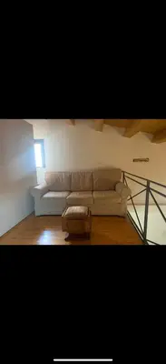 a living room with a couch and a coffee table at Al rifugio della stazione in Palermo