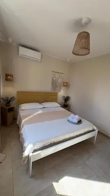 a bedroom with a bed in a room at Ciàuru di mari Mondello apartment and terrace in Palermo