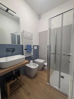 a bathroom with a sink and a toilet and a shower at Casa Mama in Palermo