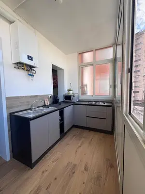 a kitchen with a sink and a counter top at Casa Mama in Palermo