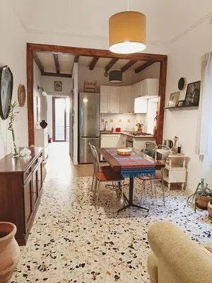 a kitchen and dining room with a table and chairs at La Casa Nei Mondi in Palermo
