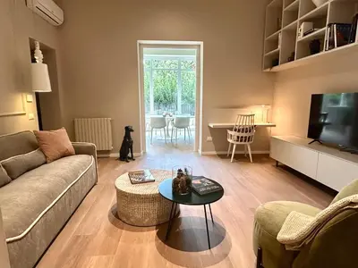 a living room with a couch and a table at YourLife Suite2 - Deliziosa casa con terrazza in Palermo
