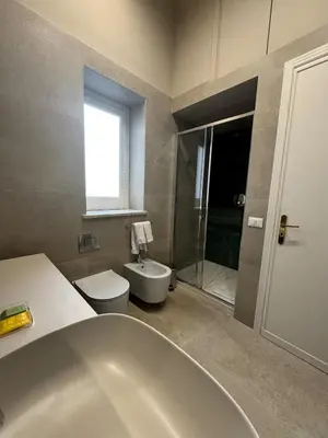 a kitchen with a sink and a table in it at YourLife Suite2 - Deliziosa casa con terrazza in Palermo