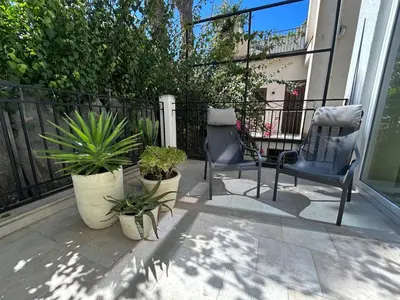 a dining room with a white table and chairs at YourLife Suite2 - Deliziosa casa con terrazza in Palermo