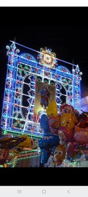 a house decorated with christmas lights and balloons at ANGELA Rooms in Marineo