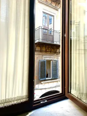 a window view of a building with a balcony at Tinchitè - A due passi dal Teatro Massimo in Palermo