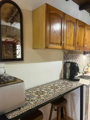 a kitchen with a counter top and a sink at Settebello - Antica Mangiatoia Palermitana in Palermo