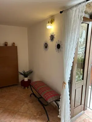 a room with a window with a curtain next to a door at Settebello - Antica Mangiatoia Palermitana in Palermo