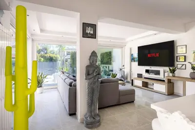 a living room with a statue in the middle at Elegant Villa With Pool Luxury in Carini