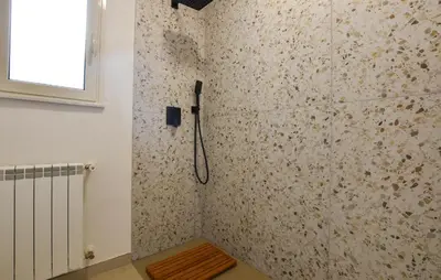 a shower in a bathroom with a wall at Amazing Home In Caccamo in Caccamo
