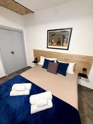 a bedroom with a large bed with two pillows at Nel Cuore del Capo in Palermo