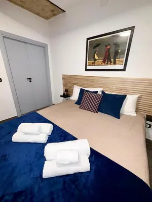 a bedroom with a large bed with two pillows on it at Nel Cuore del Capo in Palermo