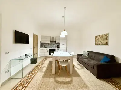 a living room with a couch and a table at Dimora Sant'Agostino in Palermo