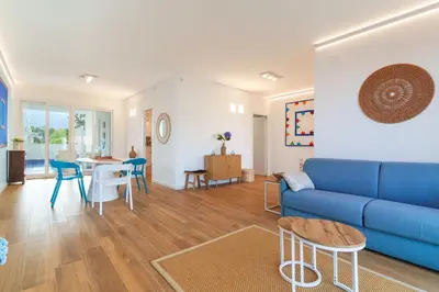 a bedroom with a large bed and a large window at Luxury apartment Villa Vera Mondello - Palermo in Mondello