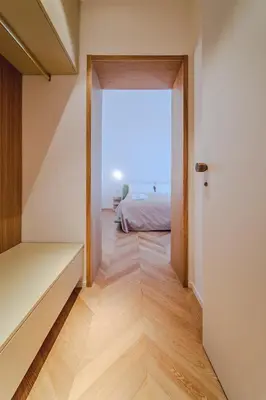 a room with a bed and a door to a bedroom at Seasicily Boutique Apartment in Palermo