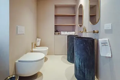 a bathroom with a toilet and a sink at Seasicily Boutique Apartment in Palermo
