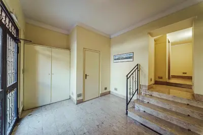 an empty hallway with stairs and a door at Seasicily Boutique Apartment in Palermo