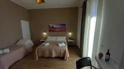 a hotel room with a bed and a window at Casa Vacanze Cipriano in Casteldaccia