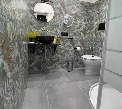 a bathroom with a sink and a toilet at La Suite del Viaggiatore in Palermo