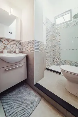 a bathroom with a toilet and a sink and a shower at CastroViva House in Palermo
