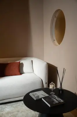 a living room with a couch and a table with a mirror at Palazzo Balsamo Boutique Hotel in Palermo
