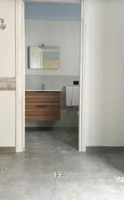 a bathroom with a sink and a mirror at Al Baglio di Sant'Elia in Santa Flavia