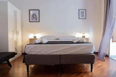 a bedroom with a large bed in a room at Casa Duci - Historic center in Palermo
