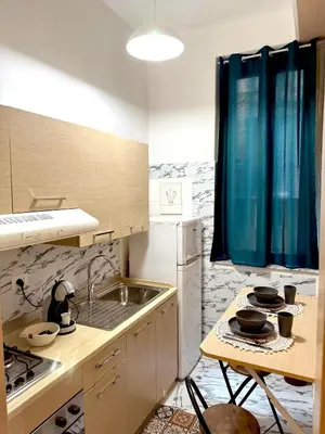 a kitchen with a sink and a counter top at Casa Amuri in Palermo