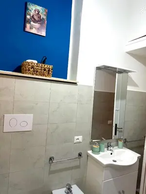 a bathroom with a sink and a mirror at Casa Amuri in Palermo