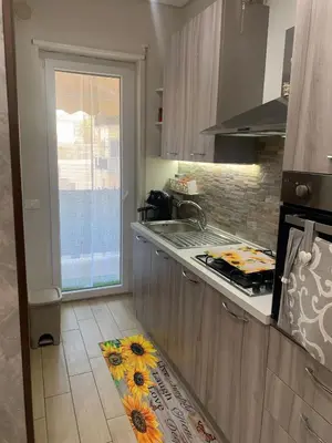 a kitchen with a stove and a counter top at Girasole Marino in Palermo
