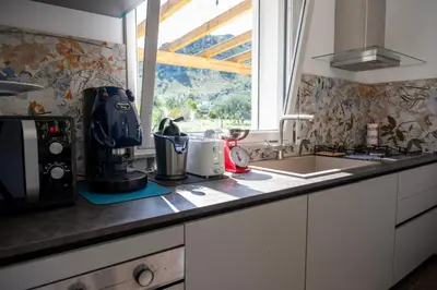 a kitchen counter with a sink and a window at Villa Verde - Nature Holiday Home in Carini