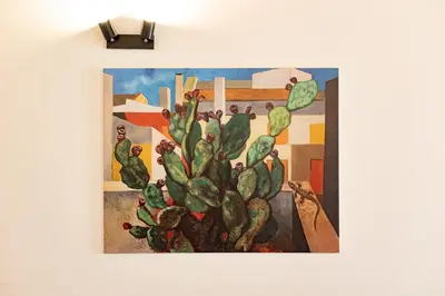 a painting of a cactus on a wall at Cathedral Apartment - Stay in Palermo in Palermo