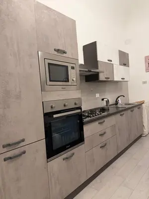 a kitchen with a microwave and a stove at Palermo House 29-Central Station in Palermo