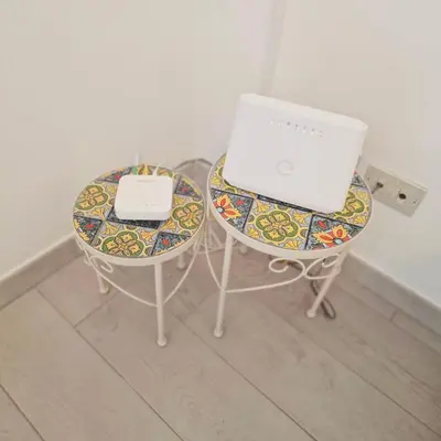 two tables with a laptop computer on top of them at Palermo House 29-Central Station in Palermo