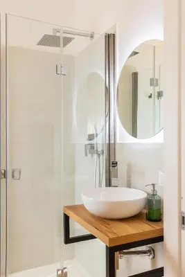 a bathroom with a sink and a shower at Donna Lia Apartment in Palermo