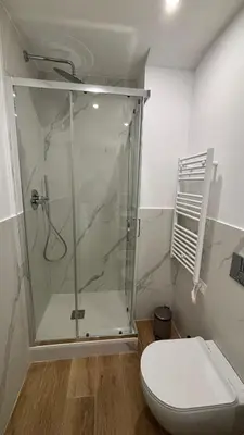 a shower stall in a bathroom with a toilet at La Casa di Simo in Palermo