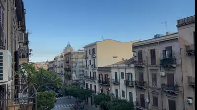 a view of a city street with buildings at Cluverio House Apartment in Palermo
