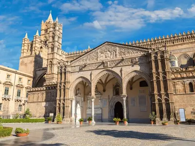 a large building with a tower and a cathedral at Donna Emma by Holiday World in Carini