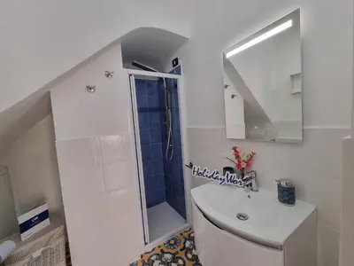 a bathroom with a shower and a toilet and a sink at Donna Elisa by Holiday World in Carini