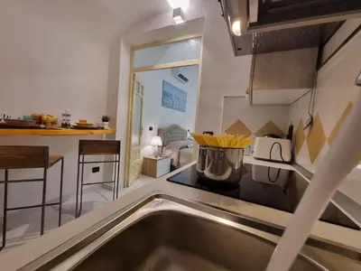 a kitchen with a sink and a counter top at Donna Lidia by Holiday World in Carini