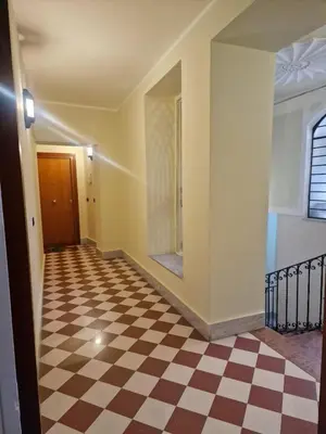 an empty hallway with a checkered floor at Balconi San Domenico in Palermo