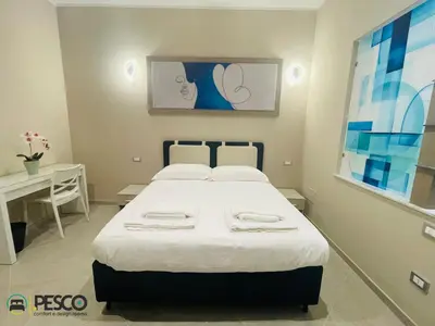 a hospital room with a bed and a table at Pesco Rooms Marineo in Marineo