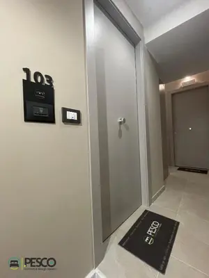 a door in a room with a sign on the wall at Pesco Rooms Marineo in Marineo