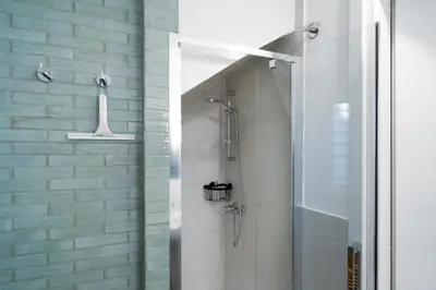 a shower in a bathroom with a glass door at ControCanto Elegant Stay - 3 bedroom flat in Palermo