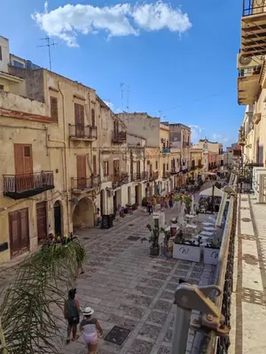 a group of people walking down a street at A casa di Adele in Castellammare del Golfo